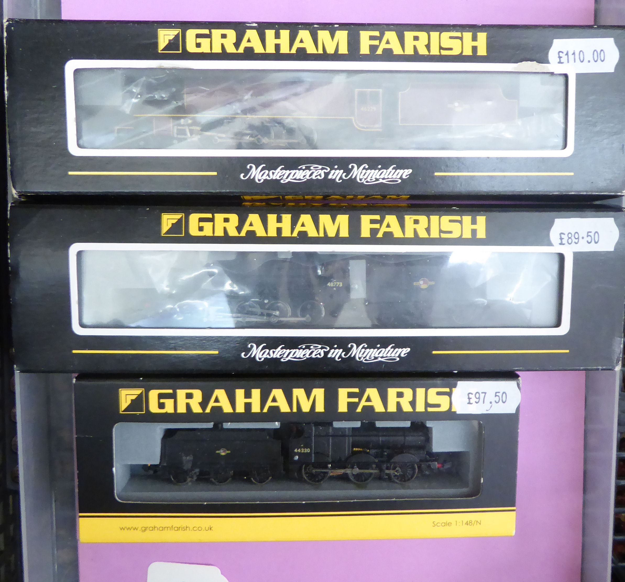 Three N gauge model railway Graham Farish locomotives and tender boxed CA