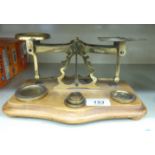 Late Victorian/Edwardian brass balance design postal scales with tablet weights,