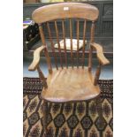 A late 19th/early 20thC beech and elm framed, spindled back, open arm Windsor chair,