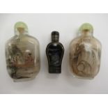Two similar 20thC Chinese glass snuff bottles; and another in black lacquered,
