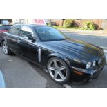 A 2008 Jaguar XJR four door 4.2 litre, petrol, automatic saloon, in black livery, reg.no.