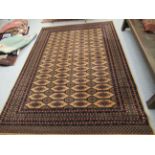 A Lano Carpets machine made Chambord rug, decorated with repeating stylised designs,