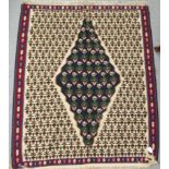 A Caucasian rug with a central medallion within a multiple leaf surround,