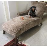 A modern daybed, upholstered in simulated leopard skin fabric,