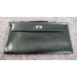 A Hermes black leather clutch bag OS6