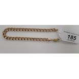 A 9ct gold flat curb link bracelet 11