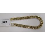 A 9ct gold fancy link bark textured bracelet 11