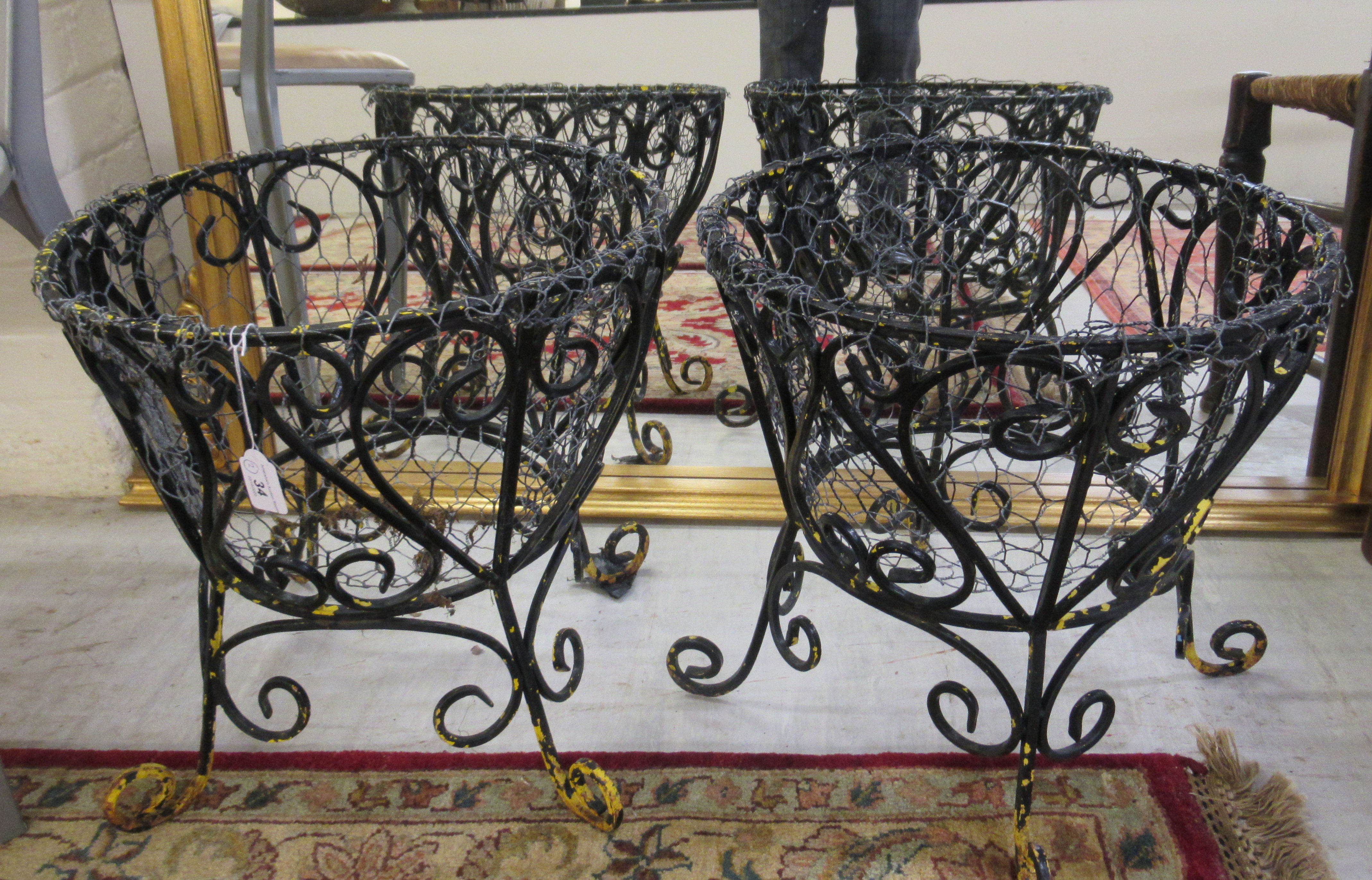 A pair of 20thC black painted wrought iron and wire shallow planters 17''h 16''dia BSR