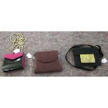 A Bruno Magli red leather clutch bag; a Louis Feraud black patent purse;
