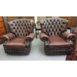 A pair of Chesterfield style armchairs,