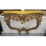 A modern 'antique' inspired gilded Rococo design serpentine front console table,