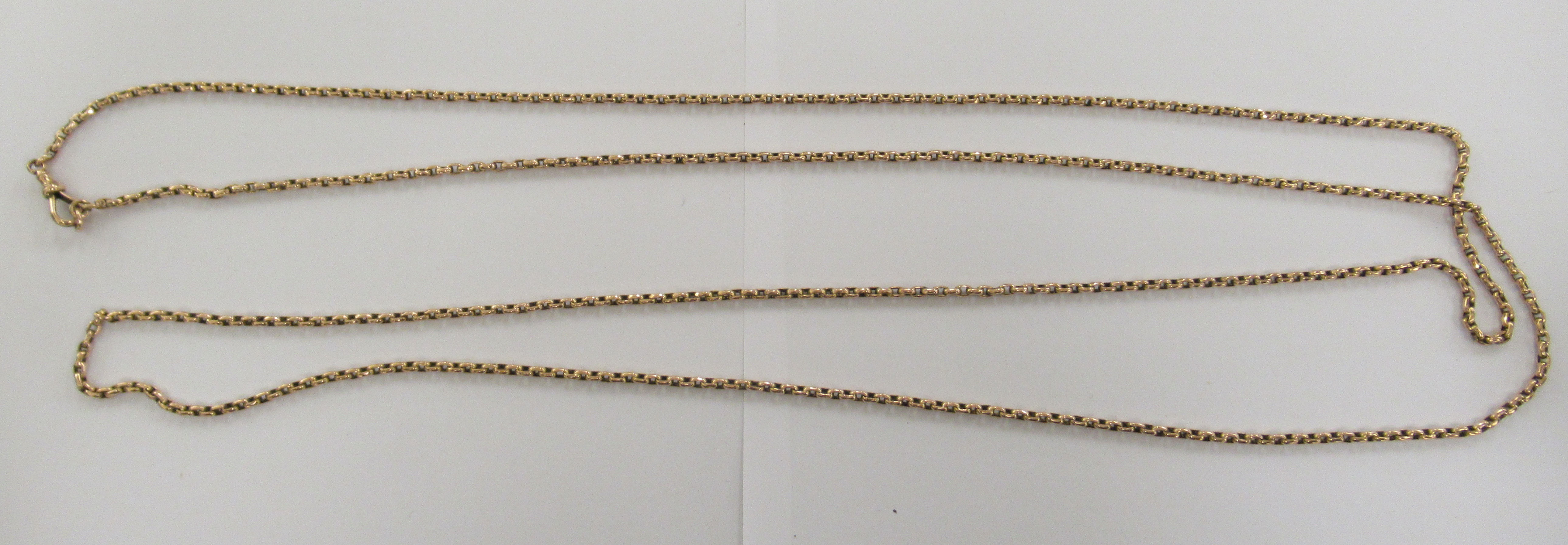 A gold coloured metal belcher link muff chain,
