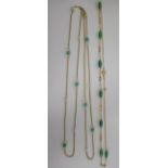 A 9ct gold neckchain, set with alternating jade beads and seed pearl; and a 9ct gold neckchain,