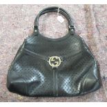A Gucci black perforated leather Reins Hobo bag SR