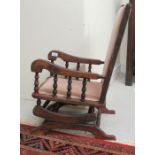 A child's 1920s American stained beech frame rocking chair,