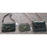 A Di Sandro black leather clutch bag; a Stuart Weitzman black patent leather clutch bag;