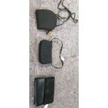 A Bruno Magli black leather clutch bag; a Stuart Weitzman black fabric clutch bag;