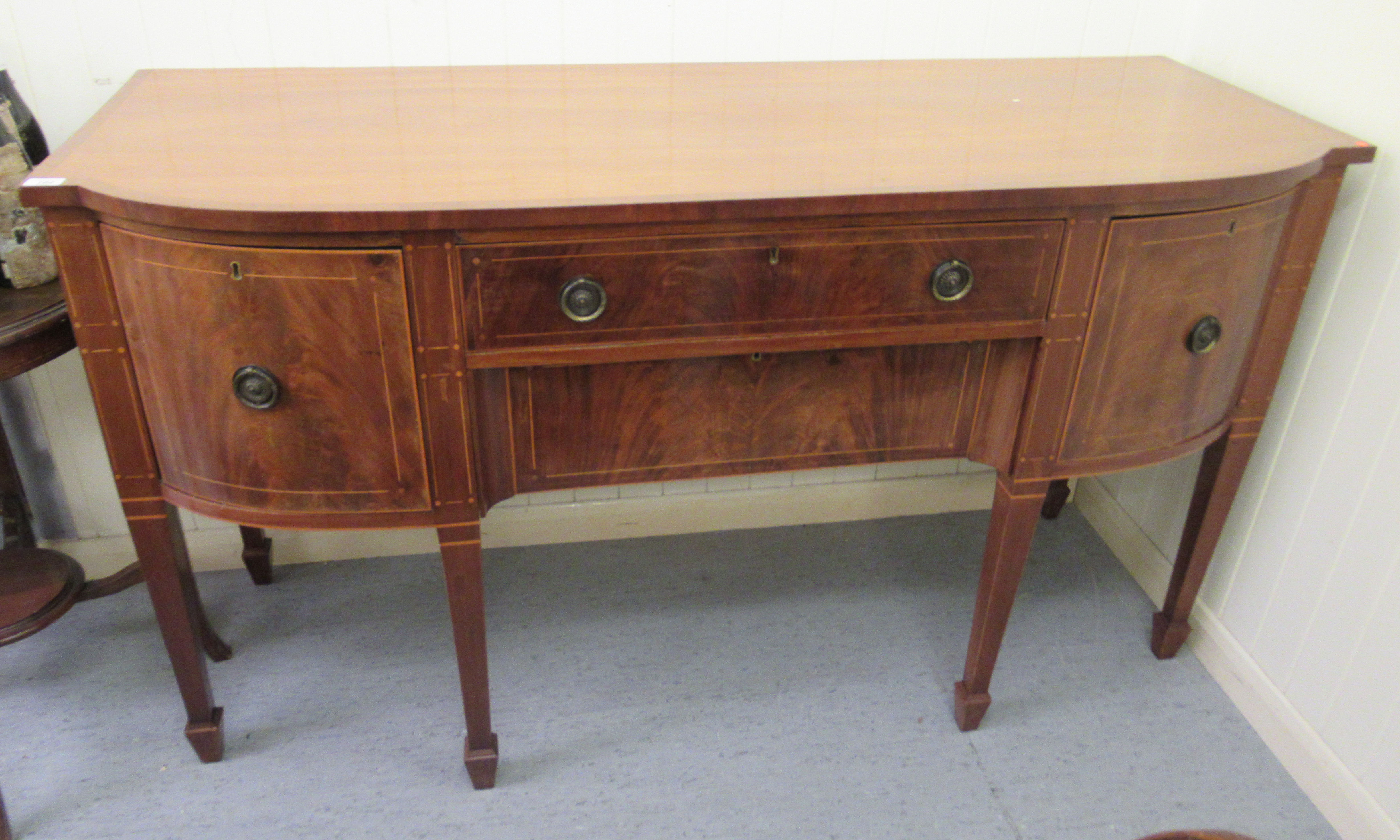 A late 19thC Georgian design satinwood inlaid mahogany breakfront sideboard,