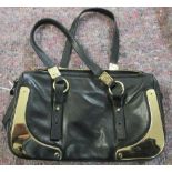 An Yves Saint Laurent black leather handbag with gilt metal mounts SR