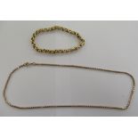 A 9ct gold chain and a gold coloured metal belcher link bracelet 11