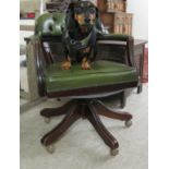 A modern captain's style mahogany finished desk chair,
