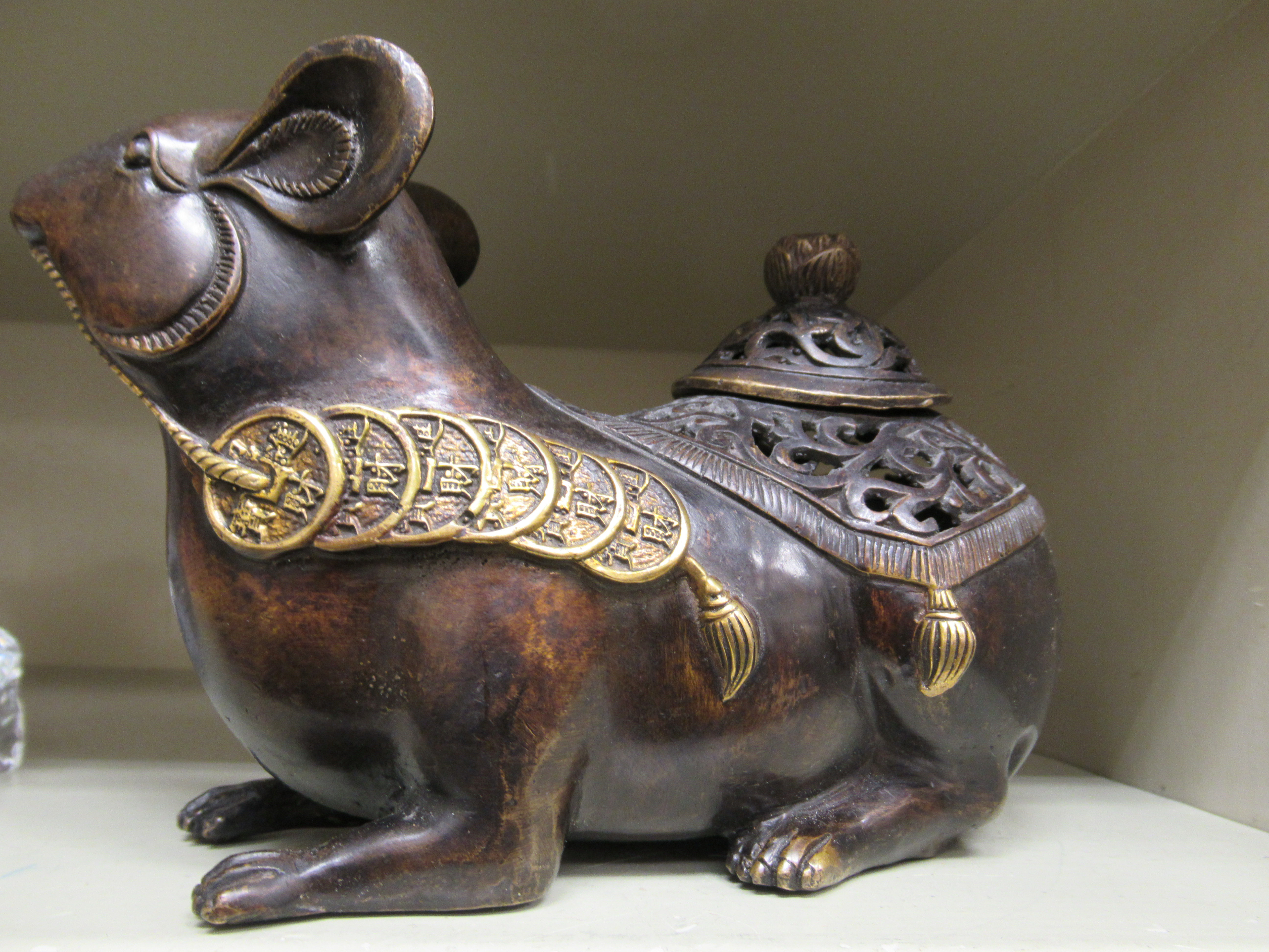 An Oriental cast and patinated and part gilded censer and cover, fashioned as a seated rodent, - Image 2 of 5