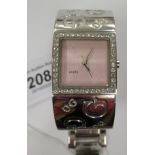 A lady's D&G stainless steel cased bracelet wristwatch, faced by a pink dial within a paste set,