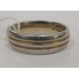 An 18ct yellow and white gold wedding band 11