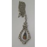 An Art Nouveau design white gold, diamond and opal pendant,