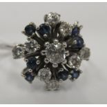 An 18ct white gold diamond and sapphire cluster ring 11