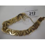 A yellow metal fancy link textured bark bracelet 11