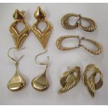 Five pairs of yellow metal fancy hoop design earrings 11