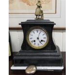 A late Victorian black slate cased mantel clock;