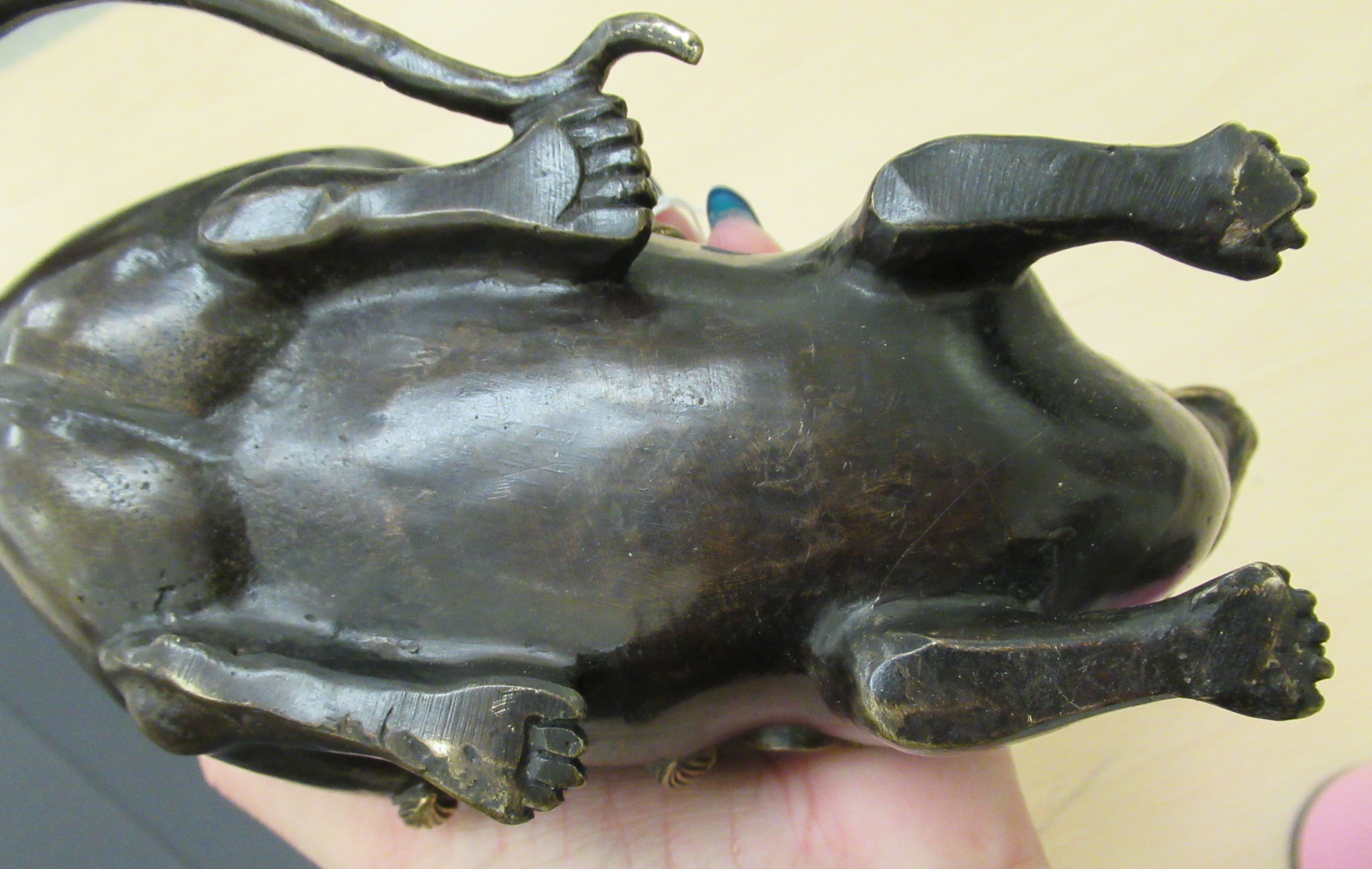 An Oriental cast and patinated and part gilded censer and cover, fashioned as a seated rodent, - Image 4 of 5