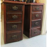 A pair of early 20thC mahogany four drawer pedestal cupboards with faux marble effect tops,