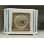 An Elliott smoked grey onyx cased mantel timepiece;