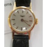 A ladies Longines 18ct gold round cased wristwatch, faced by a baton dial,