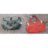 A Coach black leather and material handbag no.J3J-6821; and an Escada red leather handbag no.