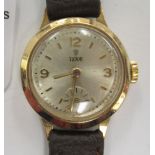 A lady's Tudor 9ct gold round cased wristwatch, faced by an Arabic and baton dial,