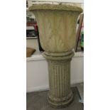 Composition stone jardiniere of tulip design with leaf ornament 24''h 25''dia,