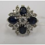 An 18ct white gold diamond and sapphire cluster ring 11