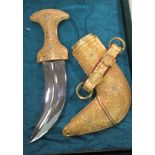 An Arabian gilt metal Cunjah and scabbard with filigree ornament the blade 8''L in a presentation