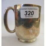 A silver Christening tankard of cylindrical form with an ear shaped handle Sheffield 1918 11