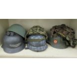 Six various German World War II style and other camouflage helmets (Please Note: this lot is