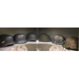 Six various German and other military helmets,