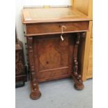 A late Victorian walnut Davenport, the box top having a brass gallery, over a hinged,