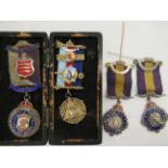 Four various Masonic related silver and enamelled medallions,