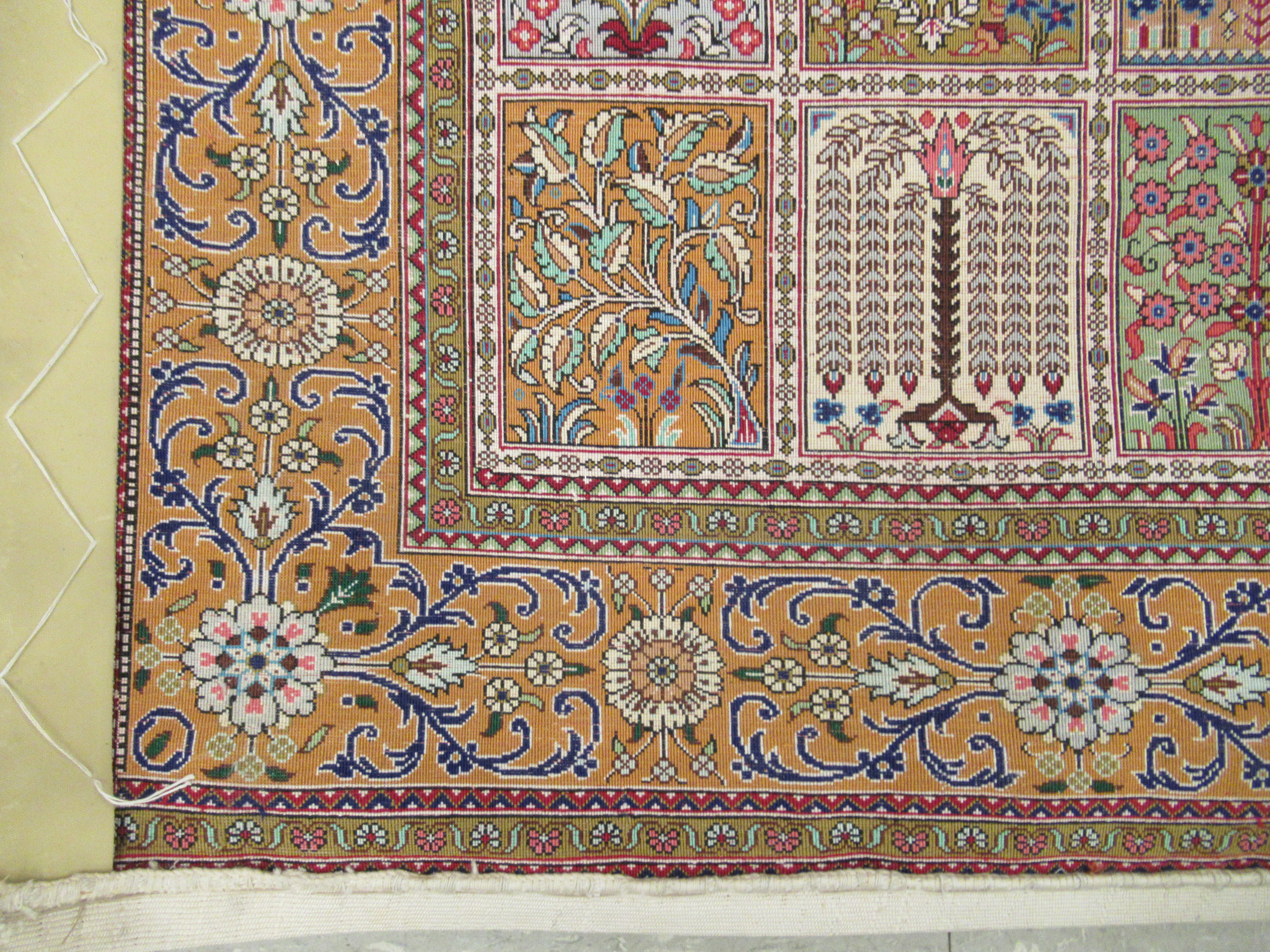 A Persian part silk/part woollen rug, decorated with repeating rectangular panels, - Image 7 of 8