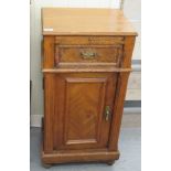 A late 19thC Continental walnut bedside cabinet with a drawer and cupboard door,