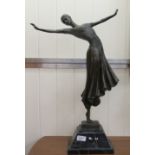 A 20thC Art Deco design cast and patinated bronze sculpture, a female dancer,